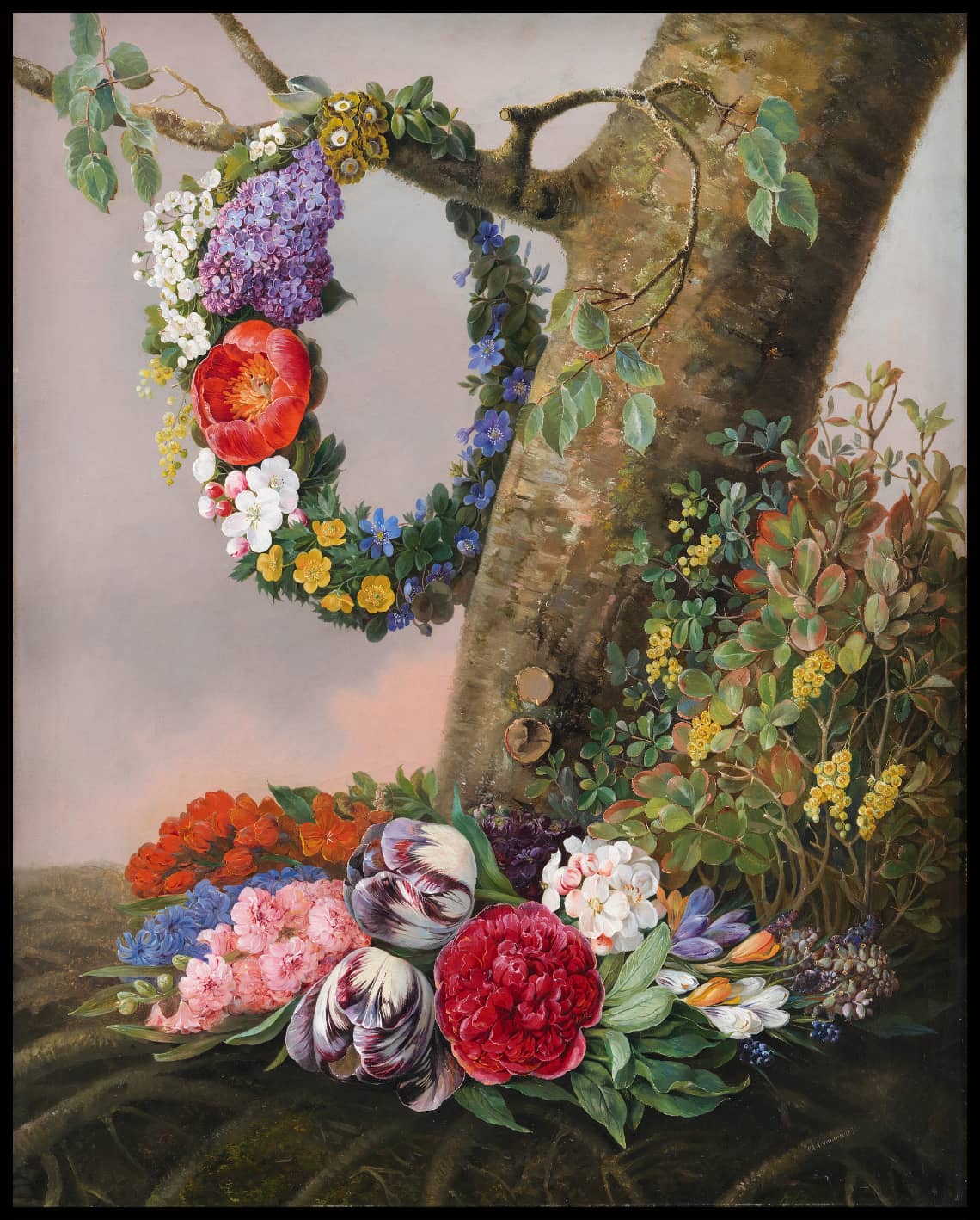 Un bouquet de fleurs au pied d'un arbre
