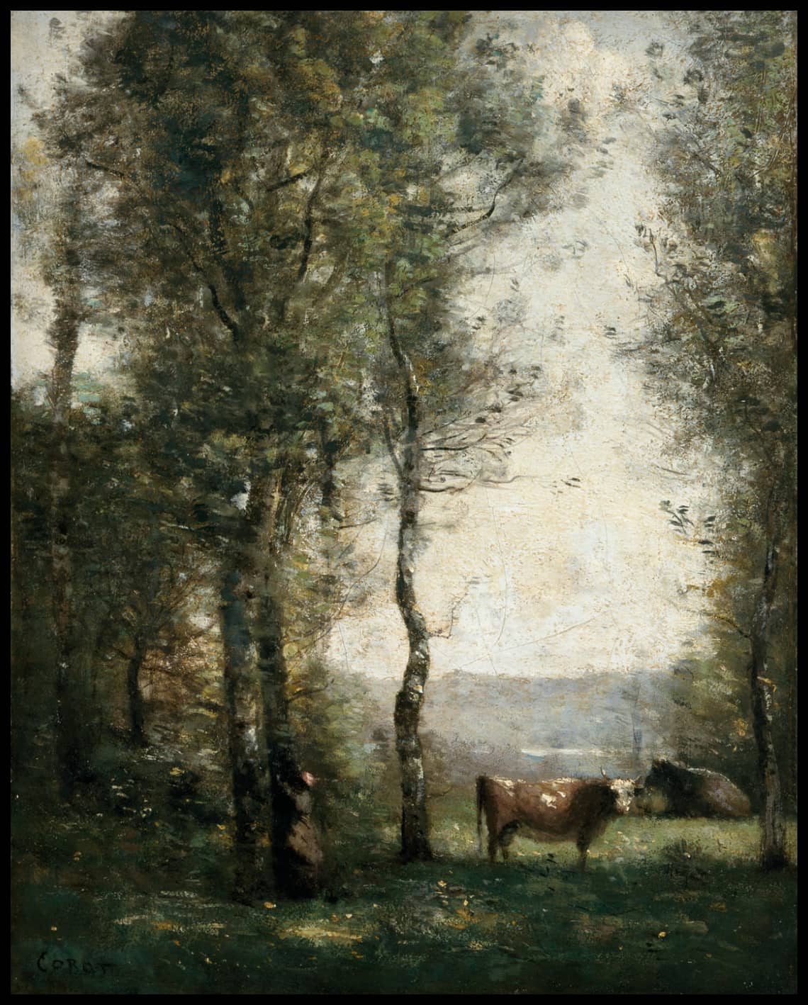 Paysage boisé avec des vaches dans un clearing