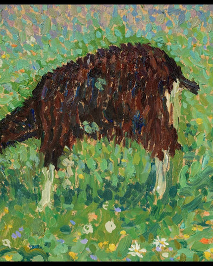 Chèvre dans un champ de fleurs