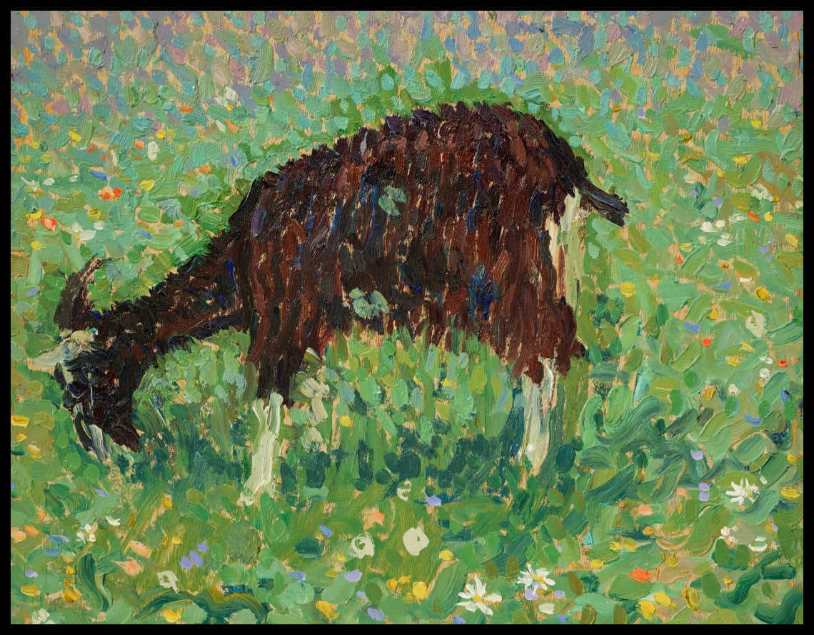Chèvre dans un champ de fleurs