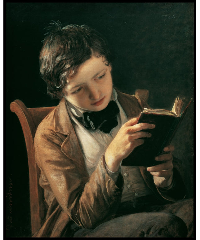 Lesender Knabe