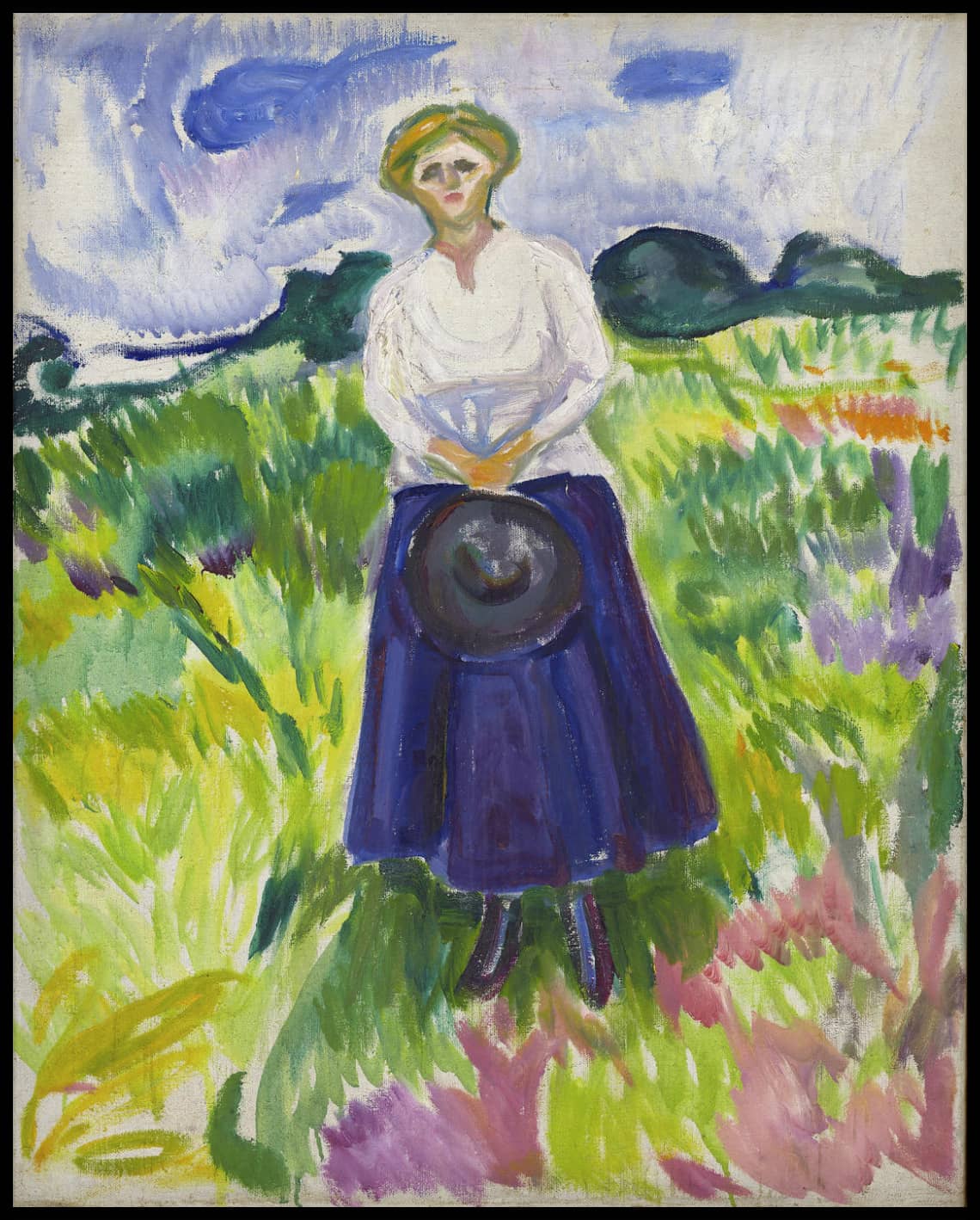 Femme dans un pré vert