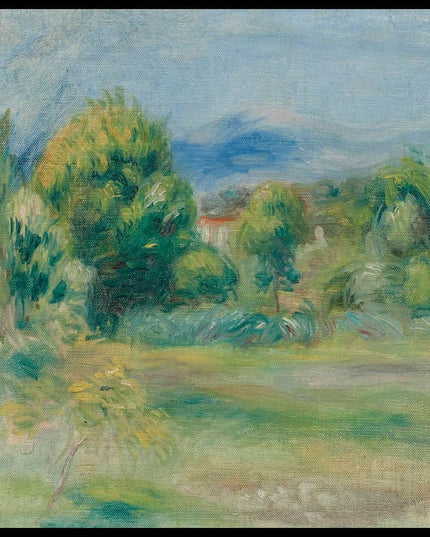 Pré et maisons derrière les arbres