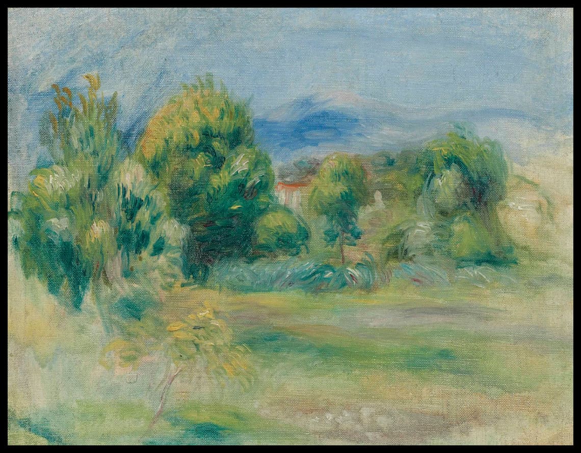 Pré et maisons derrière les arbres
