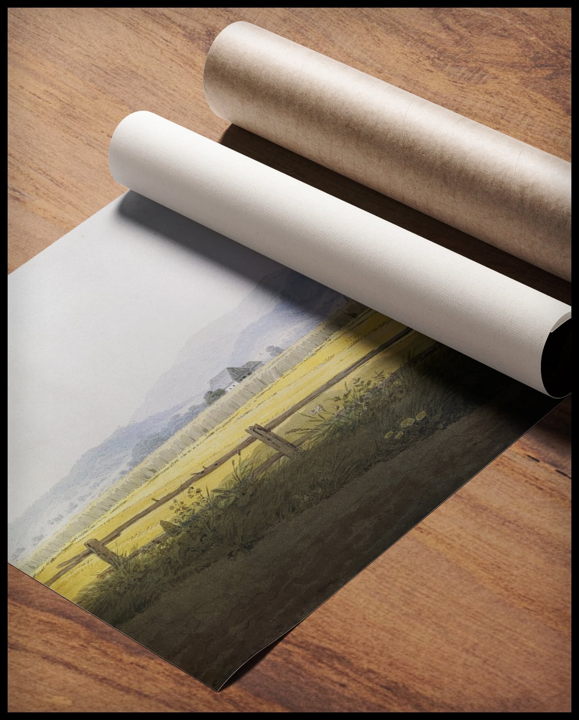 Ein Kunstdruck von einem Feld, gerollt auf einer Holzoberfläche liegend