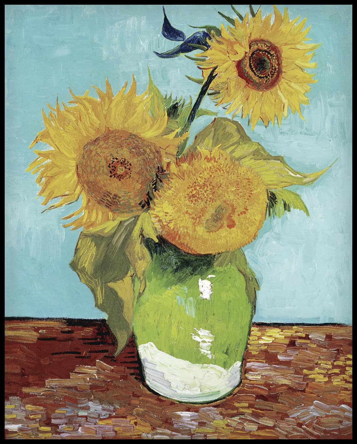 Three sunflowers in a vase