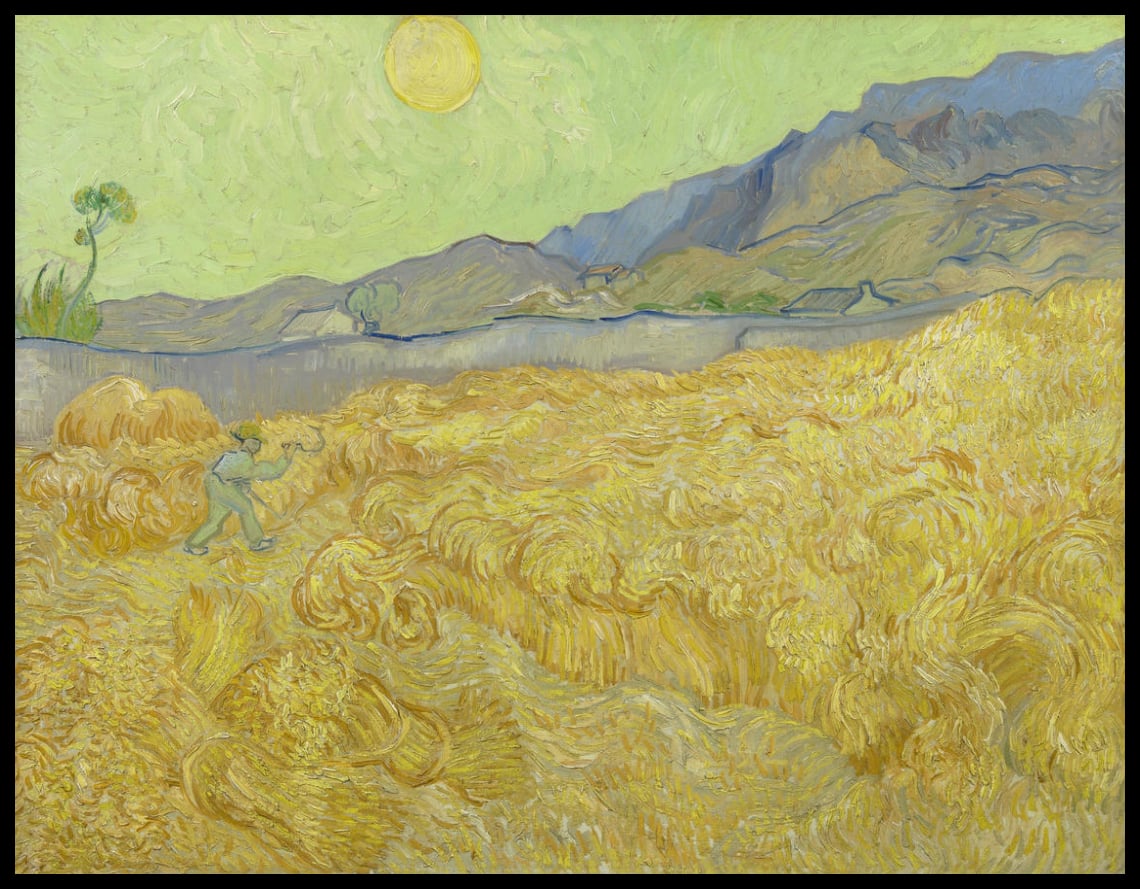 Wheat field with a reaper