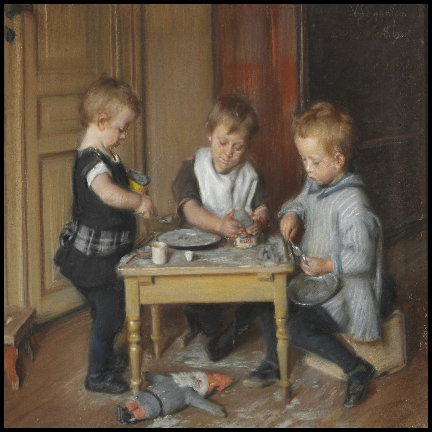 Trois des enfants de l'artiste à une table