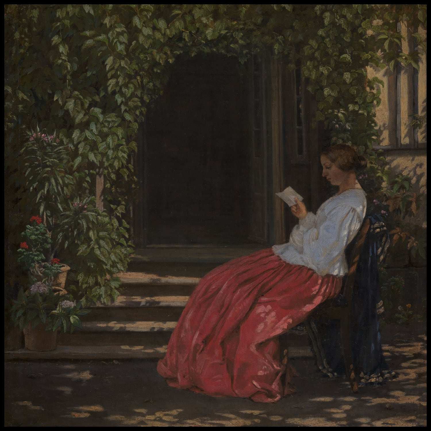 Reading lady outside a garden door