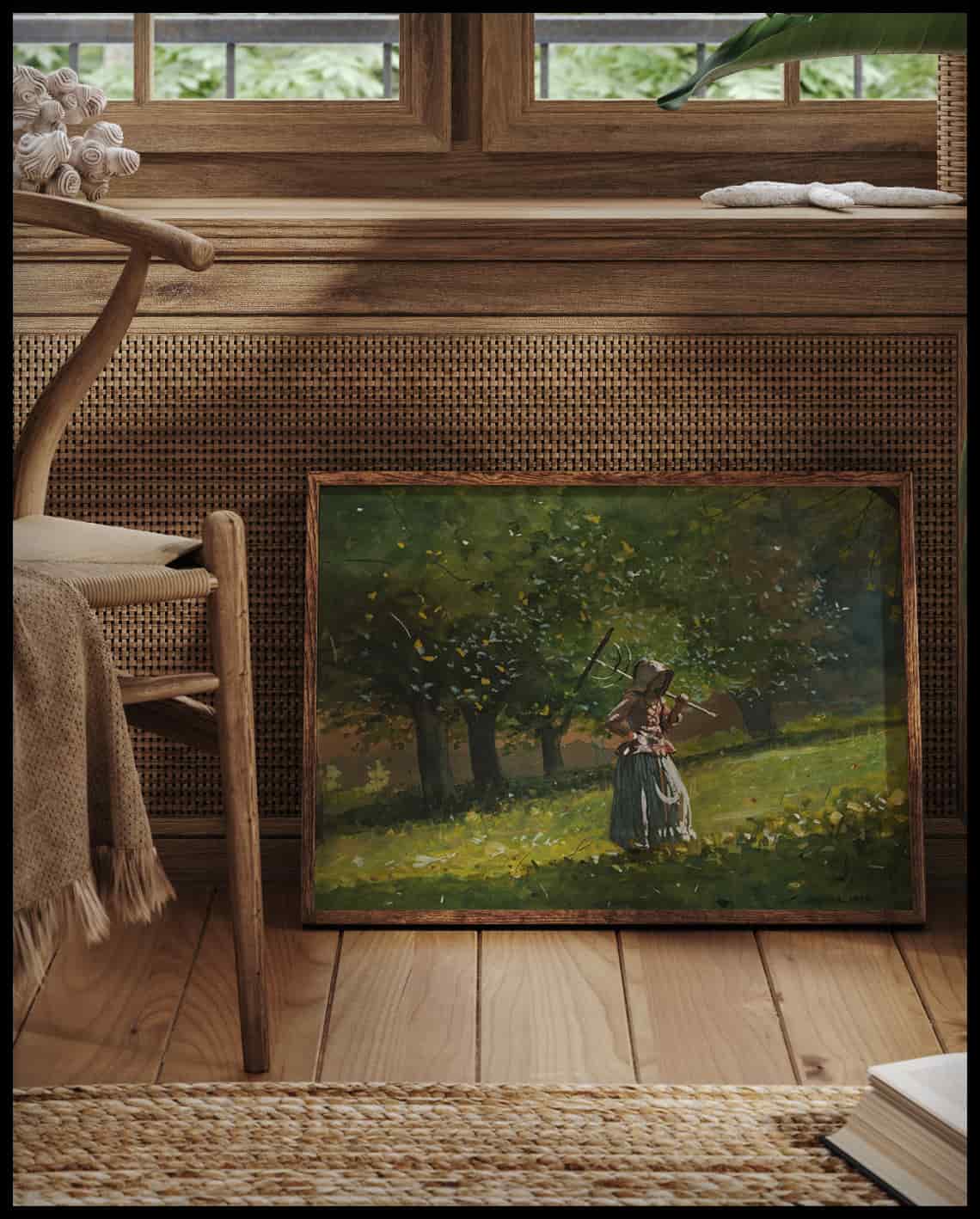 Fille avec râteau en bois