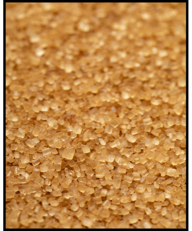 Ein Poster von einer Nahaufnahme von goldenen Zuckerpartikeln.